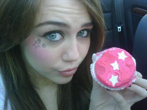  Miley Cyrus w/ a cupcake