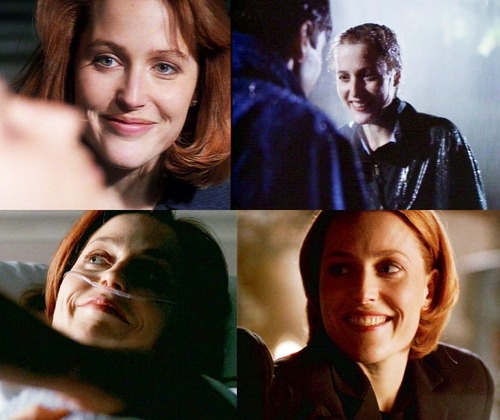  Scully smiling at Mulder :)