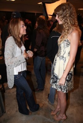  Miley and Taylor at Nashville rising a benefit tamasha backstage