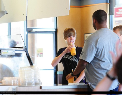 Justin bieber goes to the boston market with some friends