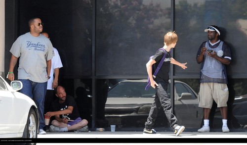 Justin bieber goes to the boston market with some friends