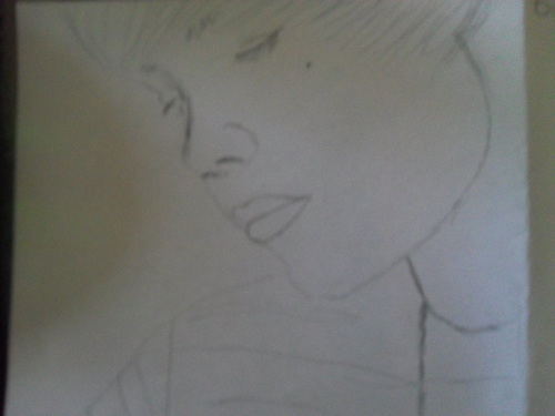  my drawing of justin bieber it's not finished yet tho <3