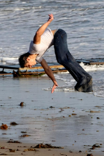  Taylor Lautner flips for Rolling Stones