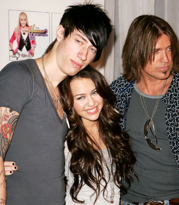 Miley Cyrus with her father and her brother