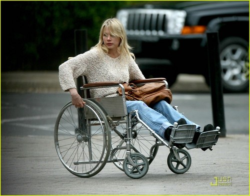 Michelle in a wheelchair on the set of her new film Blue Valentine