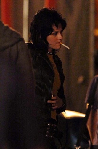  Kristen, wearing a black leather jacket.